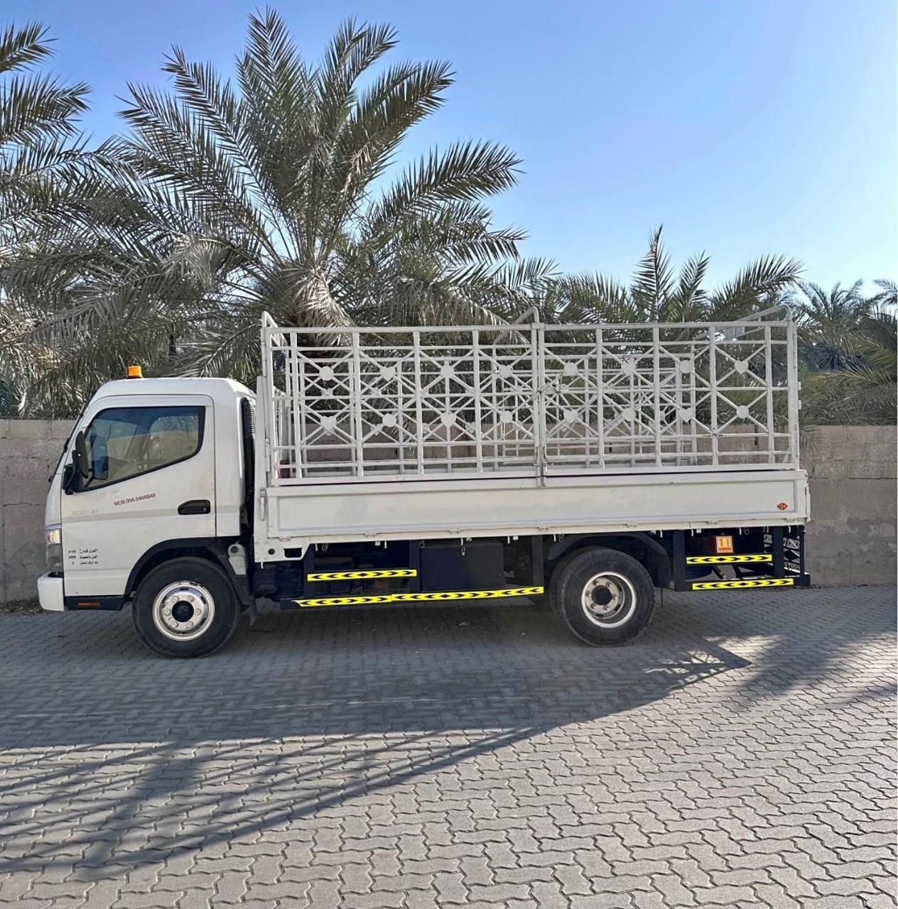 Flatbed cage truck side view